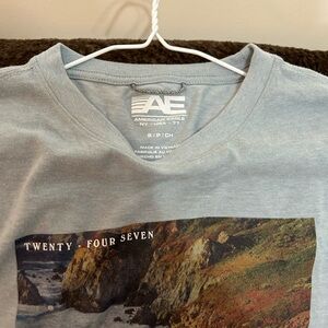American Eagle Graphic Tee in Faded Light Blue - 'Twenty Four Seven'